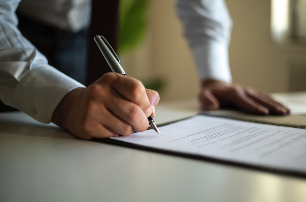 Person signing a will or contract